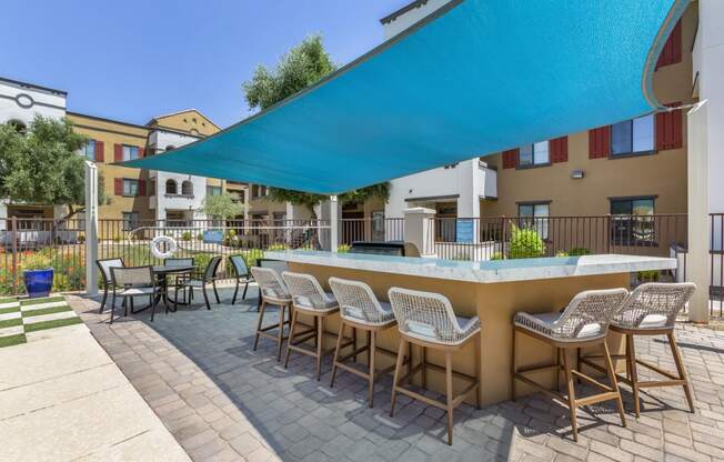 Poolside BBQ area at Trevi Apartment Homes.