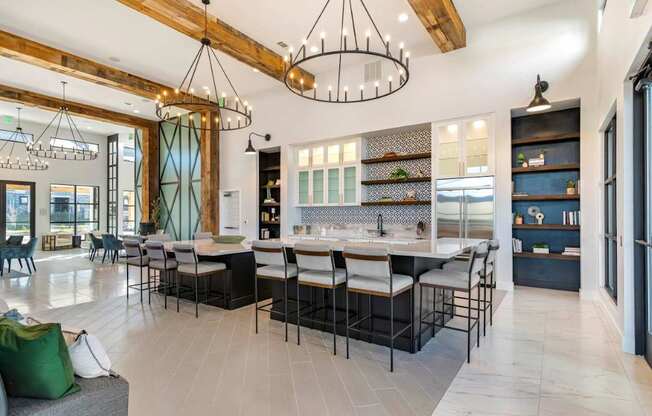 A modern kitchen with a dining area and a living room.