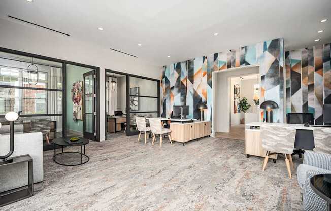 A modern living room with a grey carpet and wooden furniture.