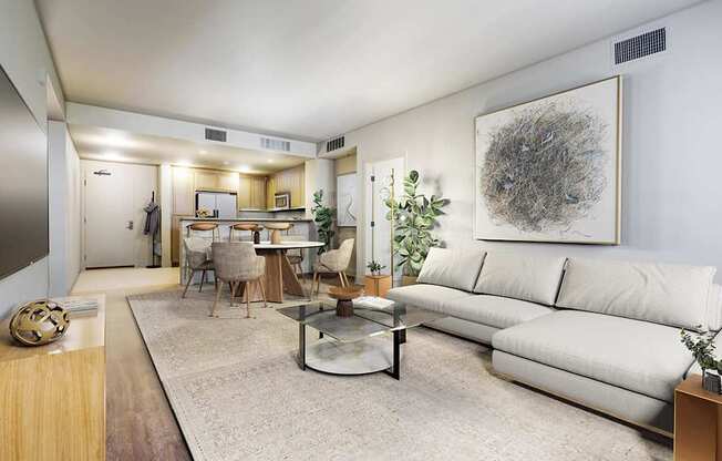 A living room with a white couch and a coffee table.