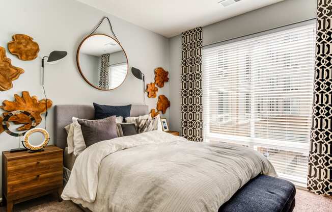 a bedroom with a large bed and a large window at Ascend Apollo, Maryland, 20746