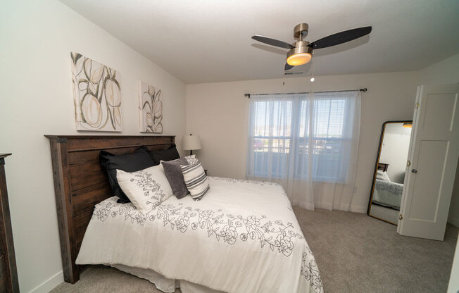 Beautiful Bright Bedroom With Wide Windows at Strathmore Apartment Homes, West Des Moines, Iowa