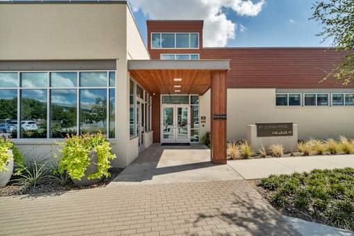 The front of a building with a brown roof and a sign that says "Concordia".