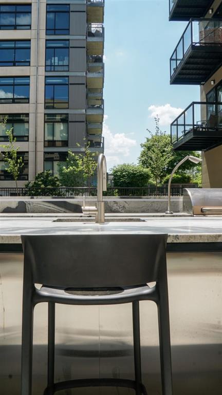 outdoor kitchen with grills, sinks and kitchen