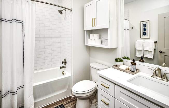 Studio, one, and two-bedroom apartment homes with stainless steel appliances, quarts countertops, designer cabinetry, large kitchens, luxury vinyl plank flooring, high vaulted ceilings, high-end lighting, in-unit washer and dryer, and energy efficient windows at Fireside at Waukee in Waukee, IA