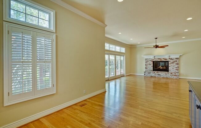 Stunning two-story spacious home on tranquil tree-lined street.