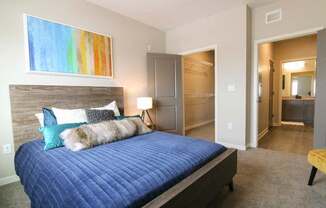 Bedroom with walk-in closet at WH Flats new luxury apartments in south Lincoln NE 68516