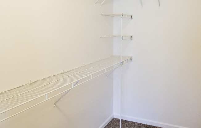 Large walk in closet with storage in master bedroom in Regency apartments Bettendorf, Iowa