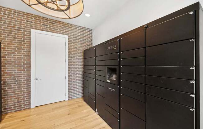 A room with a brick wall and a white door.