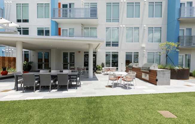 grilling patio with dining area on amenity deck at Lake Nona Pixon, Orlando, Florida