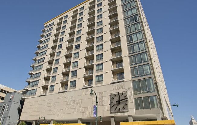 a tall building with a clock on the front of it