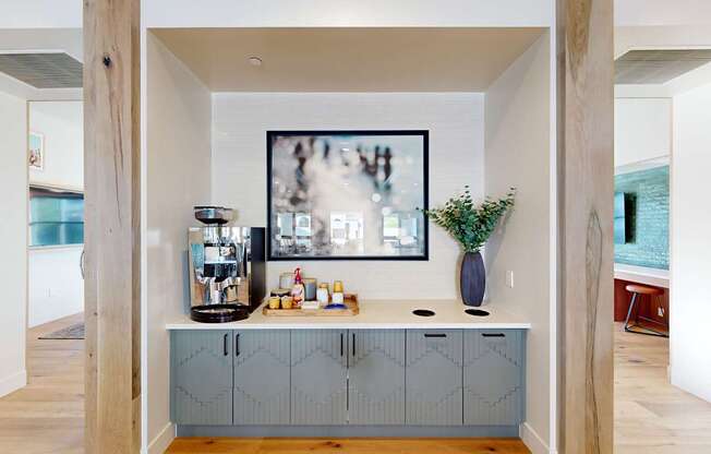 A kitchen with a large painting hanging above the counter at The Villas at Anacapa Canyon, Camarillo, 93012