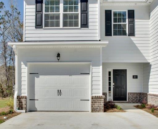 Harris Trail Luxury Townhomes for rent Richmond Hill, GA photo of white townhome with garage