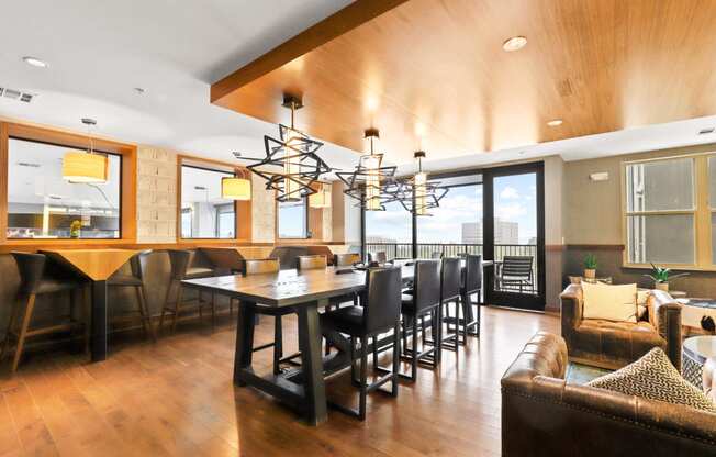 a large dining room with a large table and chairs