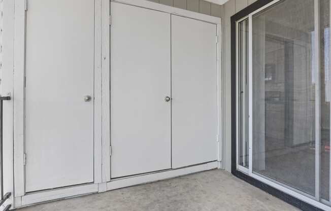 the doors to the laundry room are closed off by a wall of closets