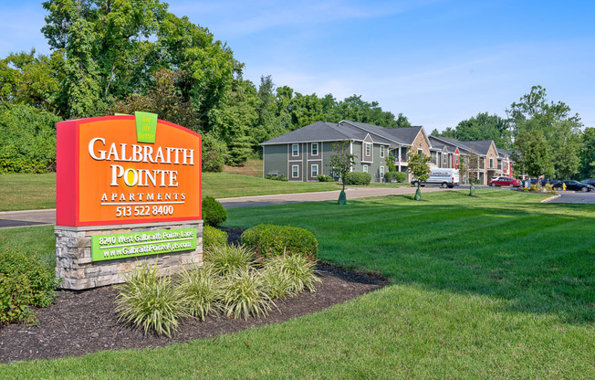 the estates at calbraband pointe sign in front of a house
