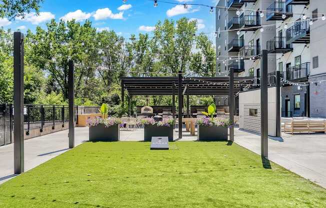 A park area with a bench and a tree in a planter box.