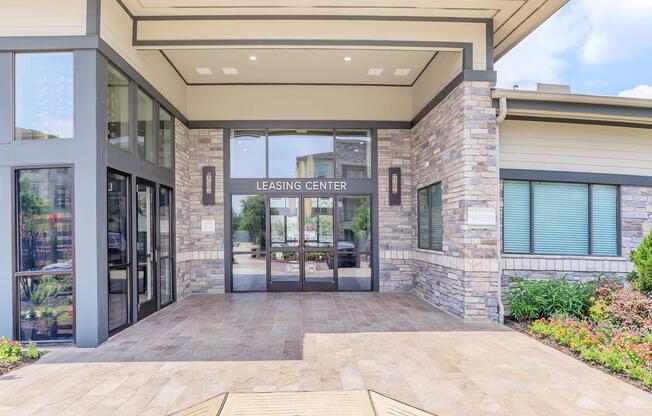 a bench in front of a brick building