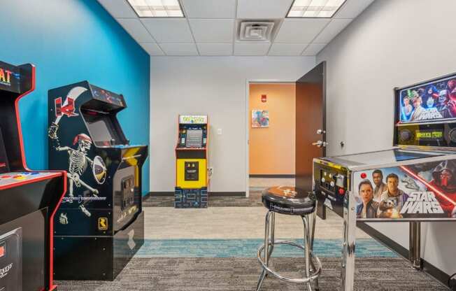 a room with arcade games and video games in it