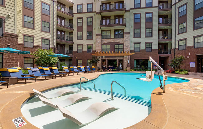 Swimming pool with tanning ledge,at 1010 Dilworth Apartments, Charlotte