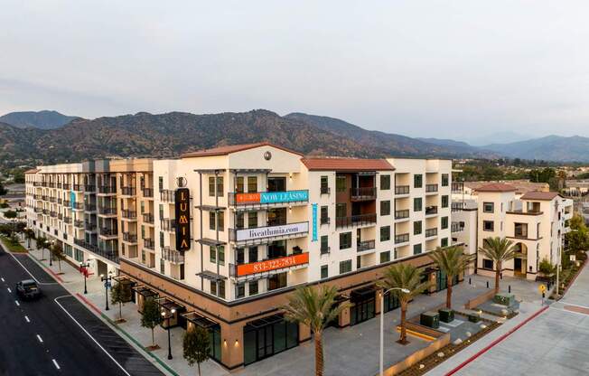 A hotel with a red awning and a sign that says