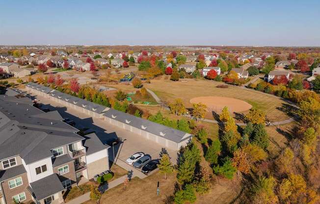 A suburban neighborhood with houses and trees in autumn colors.