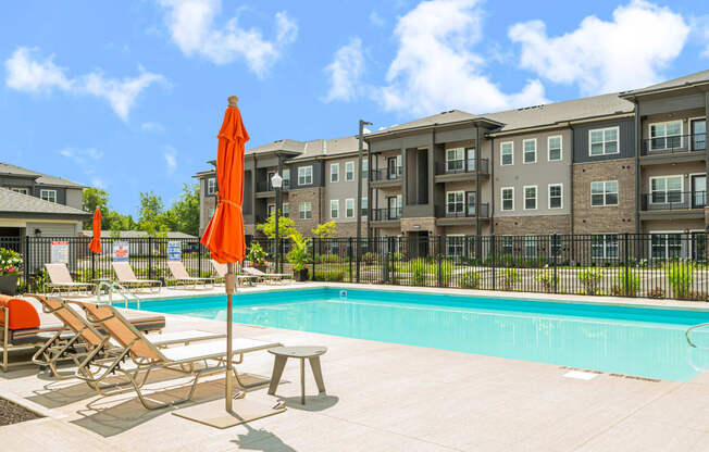 our apartments offer a swimming pool with chairs and umbrellas