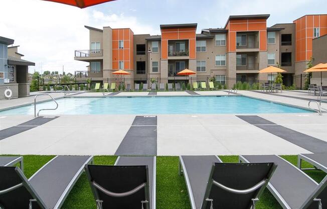 Swimming Pool With Lounge Chairs at Lofts at 7800 Apartments, Midvale, UT, 84047