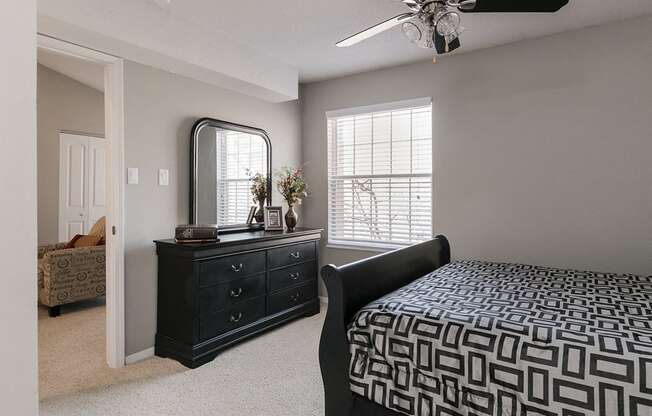 Spacious Carpeted Bedroom with Ceiling Fan