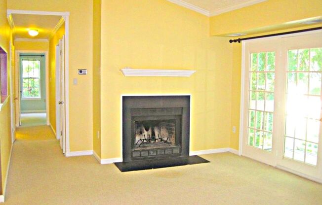 Top Floor Condo with Fireplace and Open Floorplan! Assigned Parking!