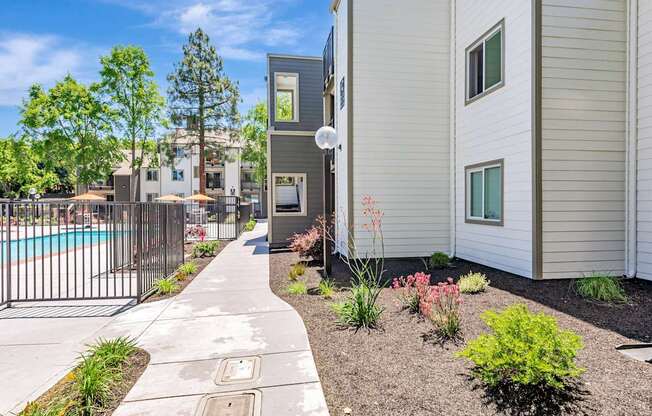 A residential area with a pool and a fence.