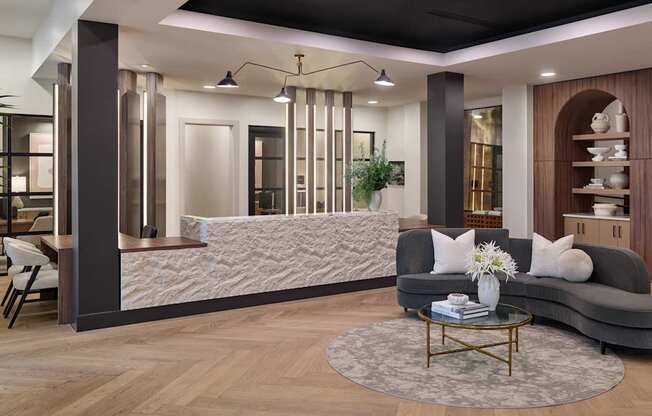 A modern living room with a grey sofa, a coffee table, and a large window with curtains.