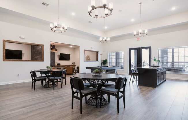 the gathering place at gardner village resident lounge with tables and chairs