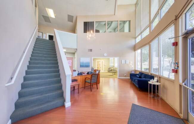 A living room with a staircase leading to the upper floor.