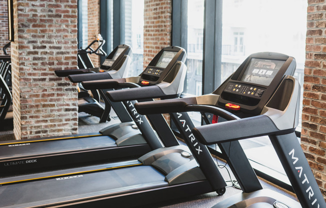 Fitness center with treadmill with cardio theatre