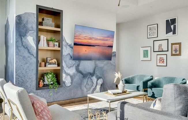 a living room with couches and chairs and a table