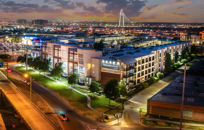 an aerial view of apartment with cityscape in background