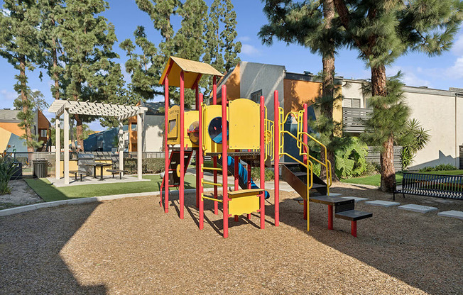 Community Playground with Slide at Horizon Apartments located in Santa Ana, CA.