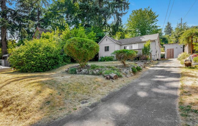 Charming 1 BD 1 BA cottage nestled on a beautifully landscaped lot