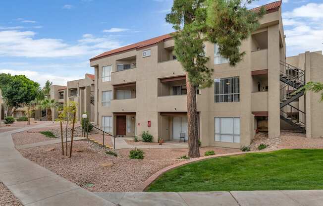 our apartments have a spacious courtyard with grass and trees