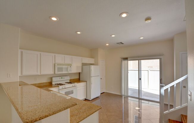 Beautiful two bedroom in great location. Step through the front door into a sun-filled great room featuring oversized tile flooring, recessed lighting, and a modern ceiling fan. Large windows and a glass slider invite natural light and frame the connectio