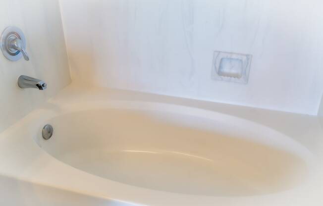 a white bathtub with a silver faucet in a 555 waverly unit