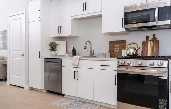 Kitchen with white cabinets and stainless steel appliances