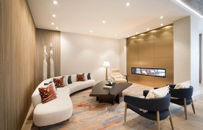 Comfortable seating and a sleek fireplace, offering a welcoming place to relax or connect throughout the day.