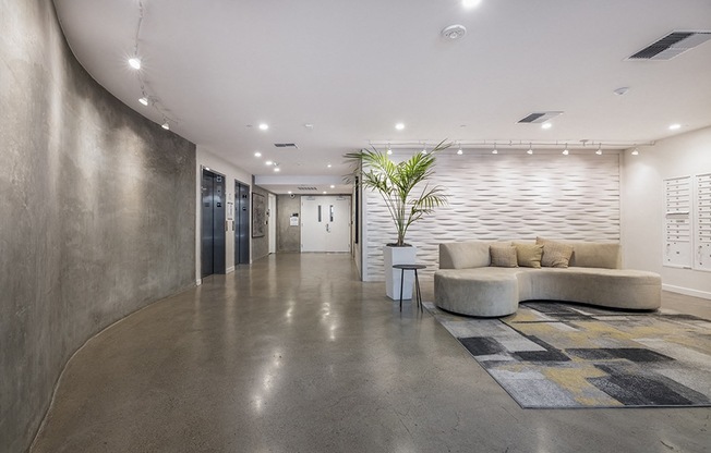 Mail room with seating and decorations Rasa Apartments