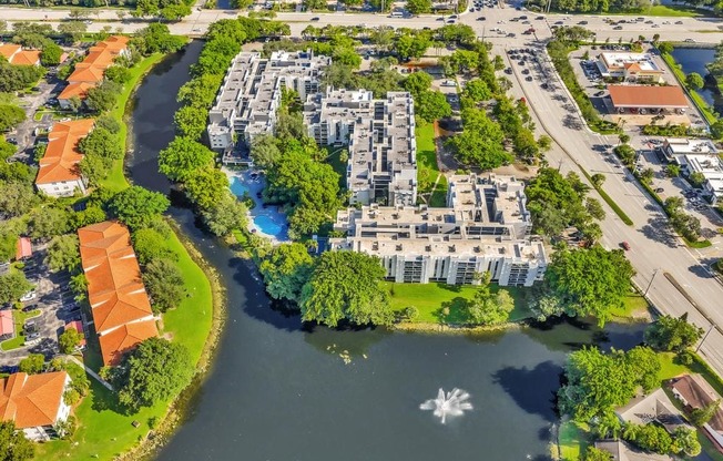 A river flows through a city with a large white star in the water.