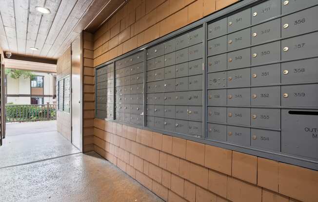 the lockers at the front of the building are full of mail