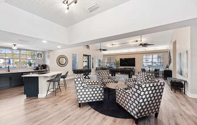 Community Clubhouse with Lounge Furniture and Kitchenette Area at Vue at Baymeadows Apartments in Jacksonville, FL.