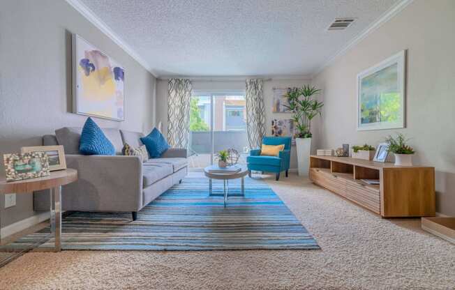 a living room with a couch and a table at City View Apartments at Warner Center, Woodland Hills, CA 91367