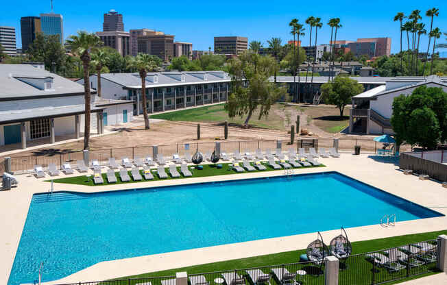 an aerial view of the pool at the resort on a sunny day at Presidio Palms Apartments, Tucson, 85701